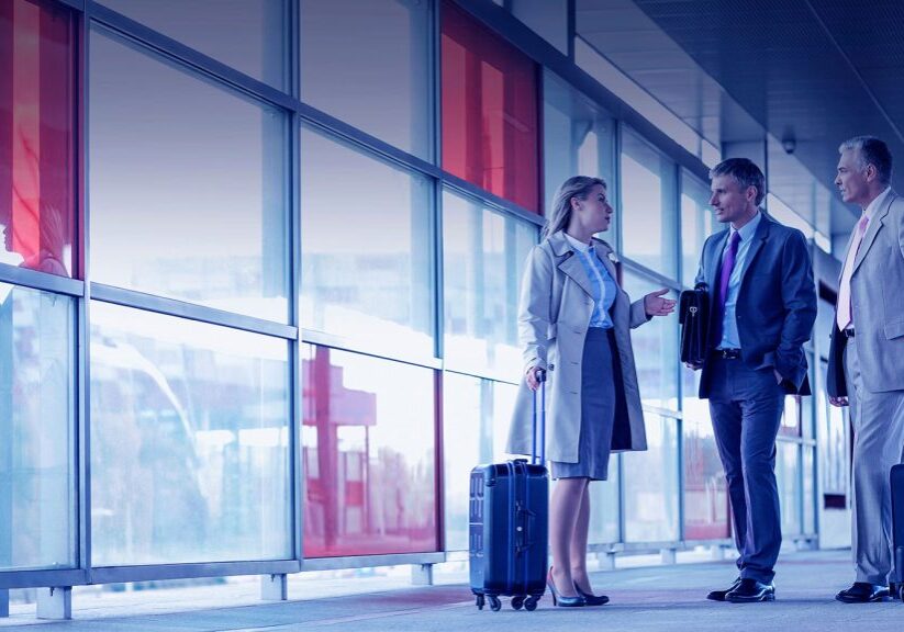 business people at airport with bags